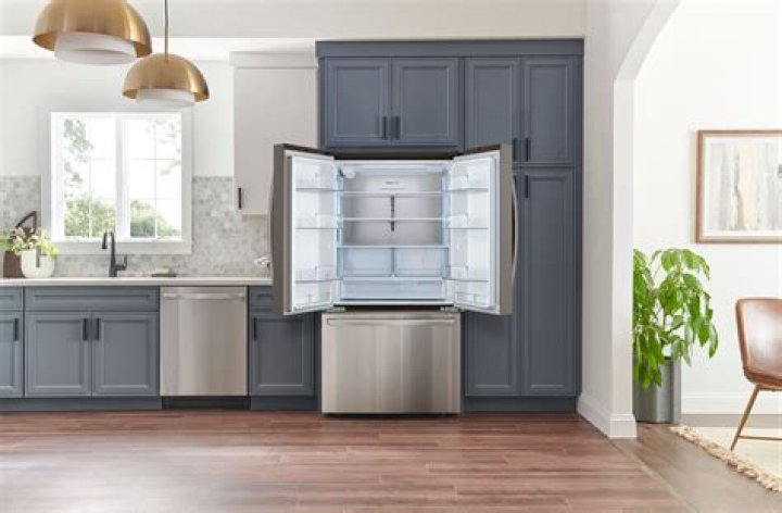 Can a refrigerator be pushed against a wall?
