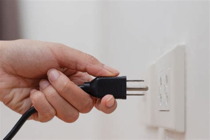Do things use electricity when plugged in but not on?