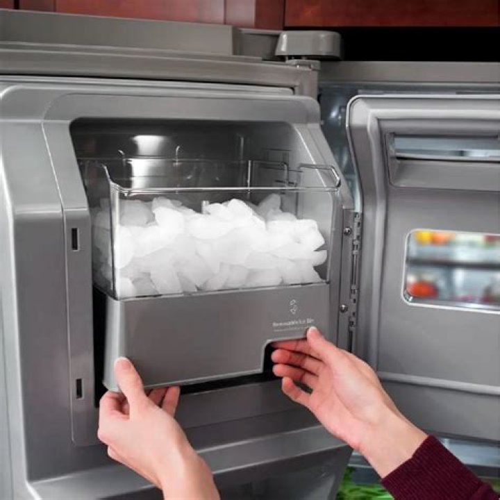 How do I get my ice maker unfrozen?
