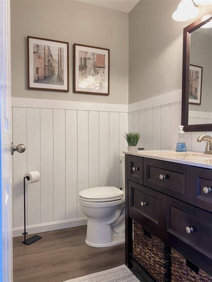 How do you cover bathroom tile with wainscoting