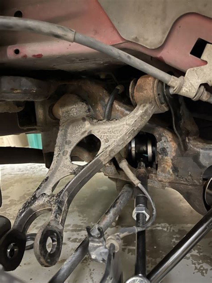 How do you remove the gas shock from a ball joint?