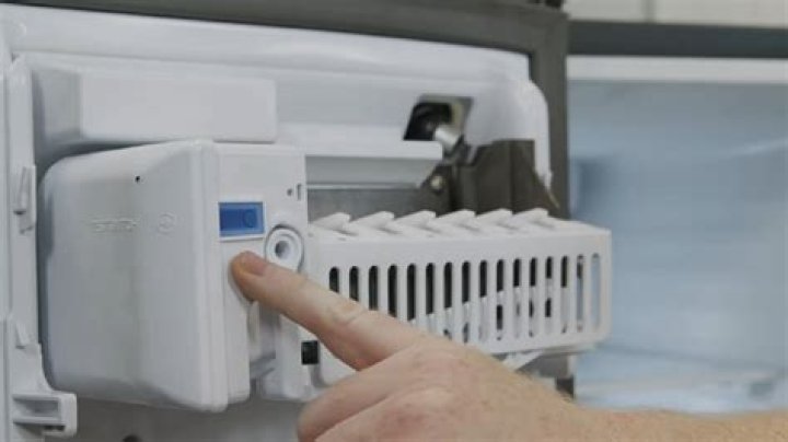 How do you reset a refrigerator in an RV?
