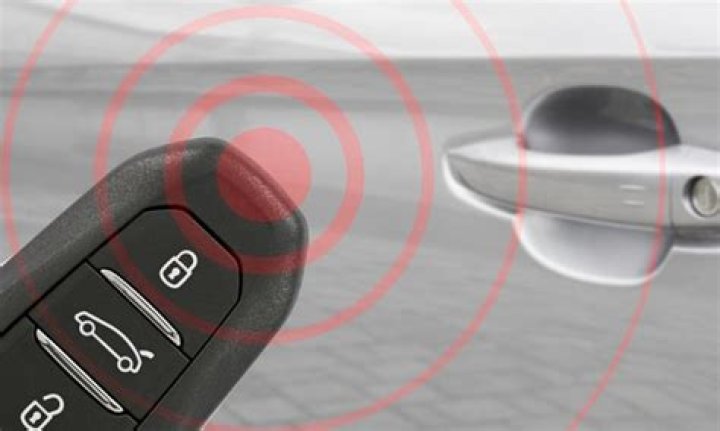 How does a paired radio transponder unlock a car?