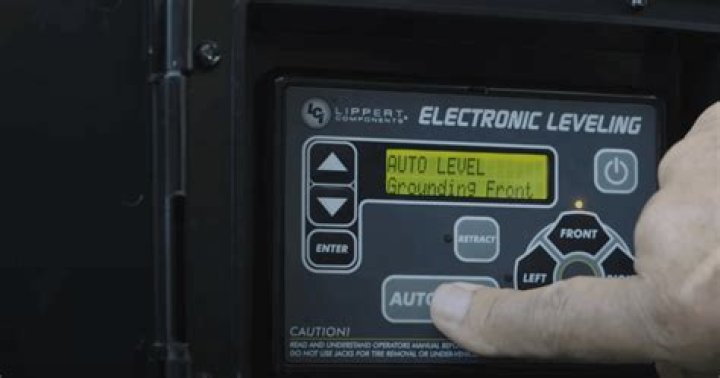 How does an automatic leveling system work on an RV?