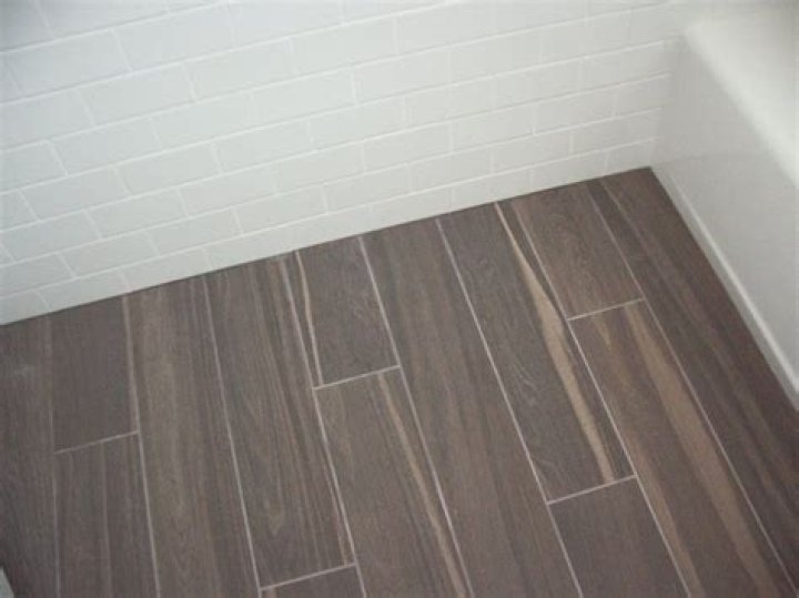 Should wall tile sit on floor tile