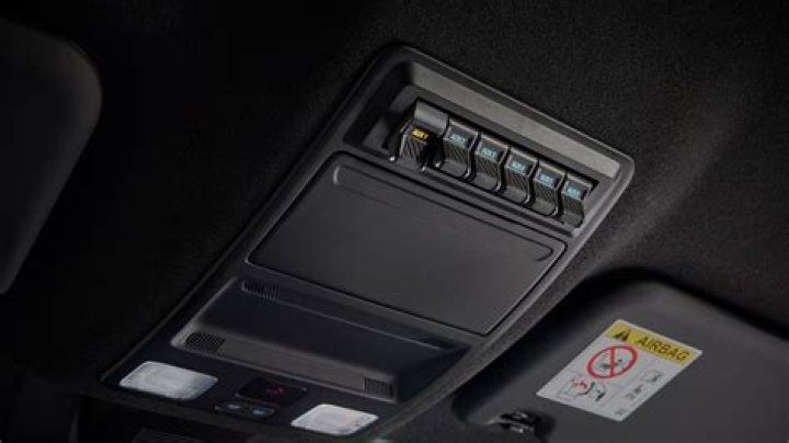 What are auxiliary switches in overhead console?