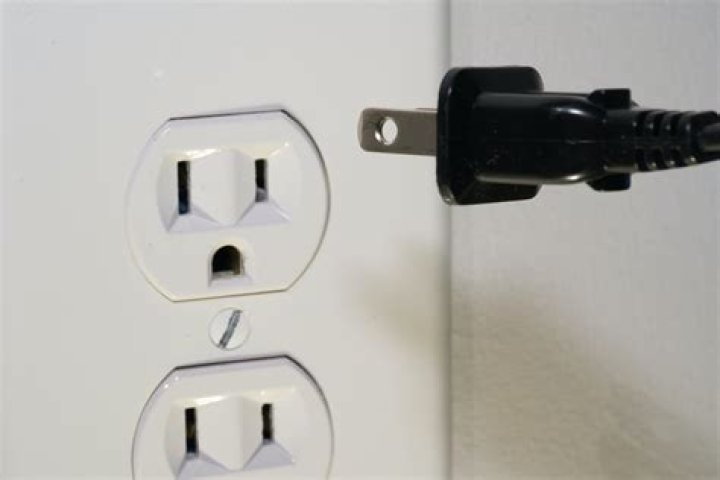 What causes an electrical outlet to stop working in a bathroom?