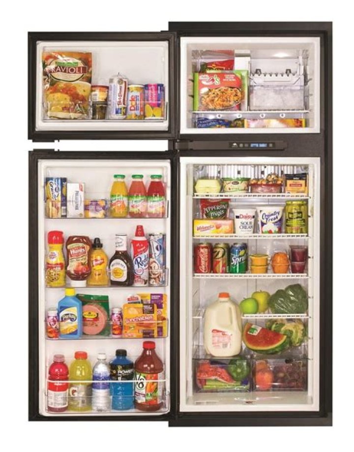When to call the service center for a Norcold refrigerator?