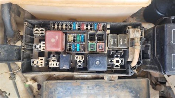 Where is headlight relay located?