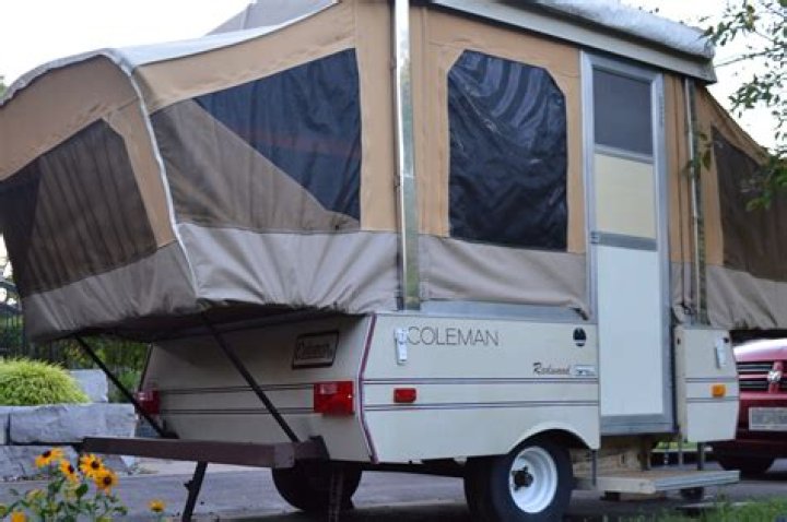 Where is the 15 amp plug on a Coleman pop up camper?