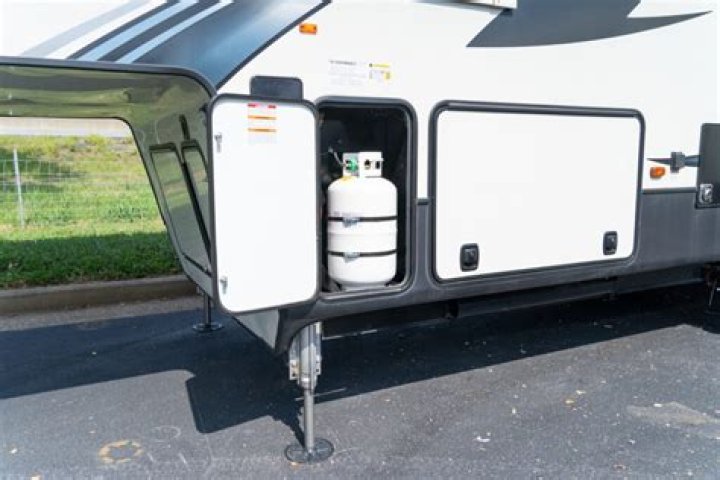 Where is the propane burner on an RV fridge?