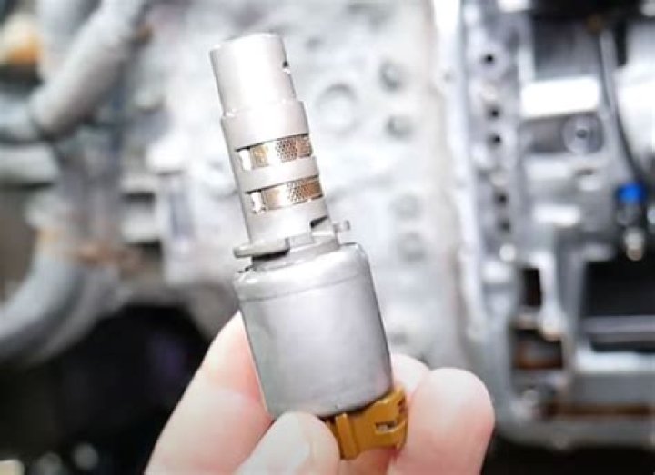 Where is the transmission pressure control solenoid located?
