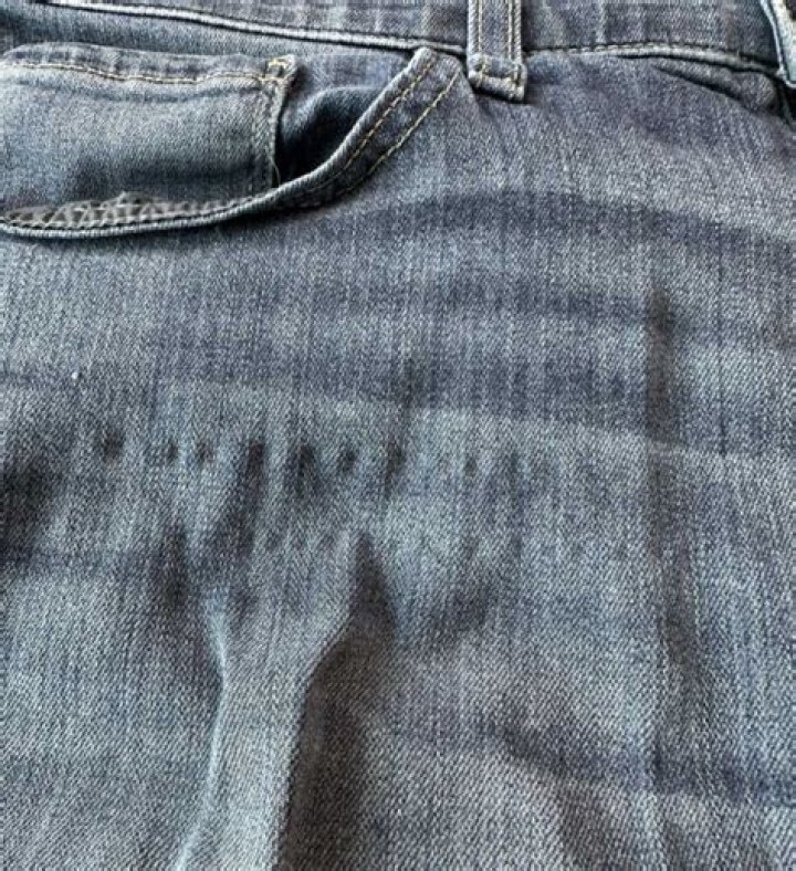 Why do jeans absorb water?