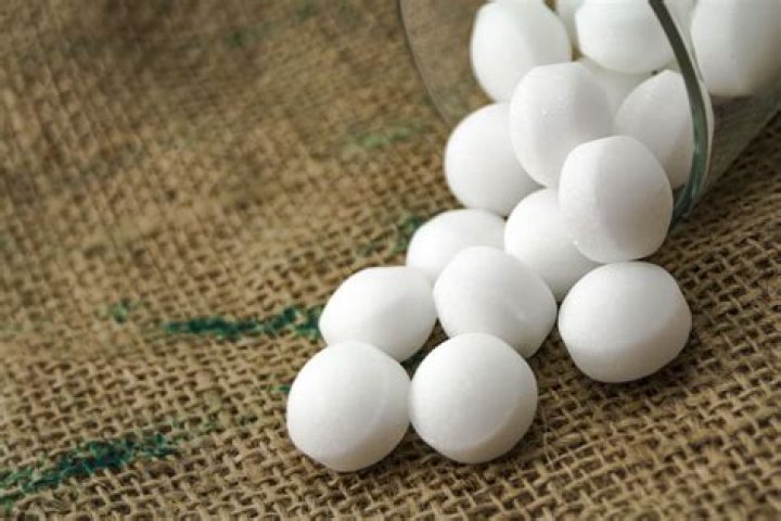 Why naphthalene balls kept in stored woolen and silk clothes?